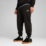 PUMA essentials no. 1 logo sweatpants men in black — model shot 3