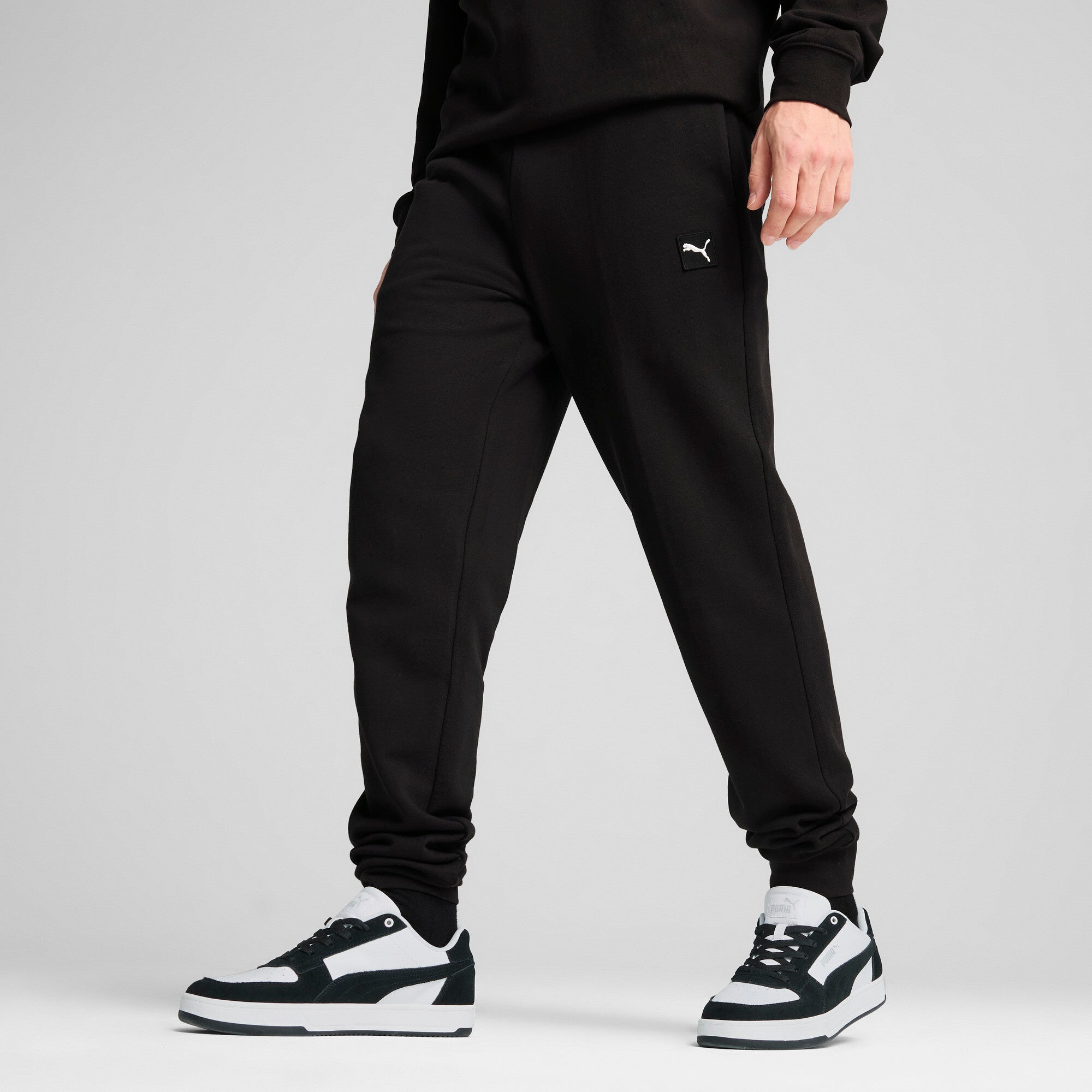 Puma essentials elevated pants in black - Model Shot 01