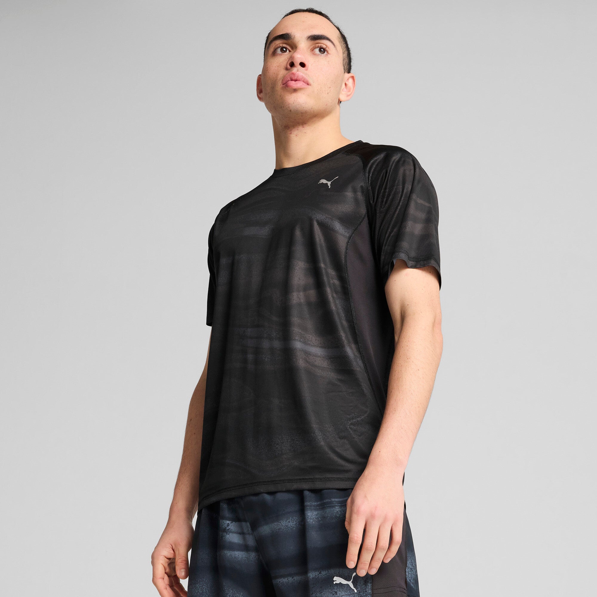 Puma running velocity all-over print tee in black - Model Shot 01