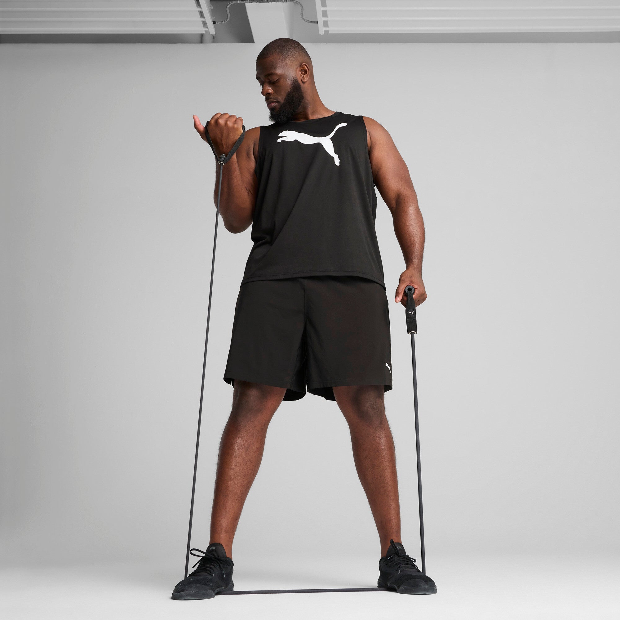 PUMA TAD ESSENTIALS sleeveless tank men in black — model shot 3