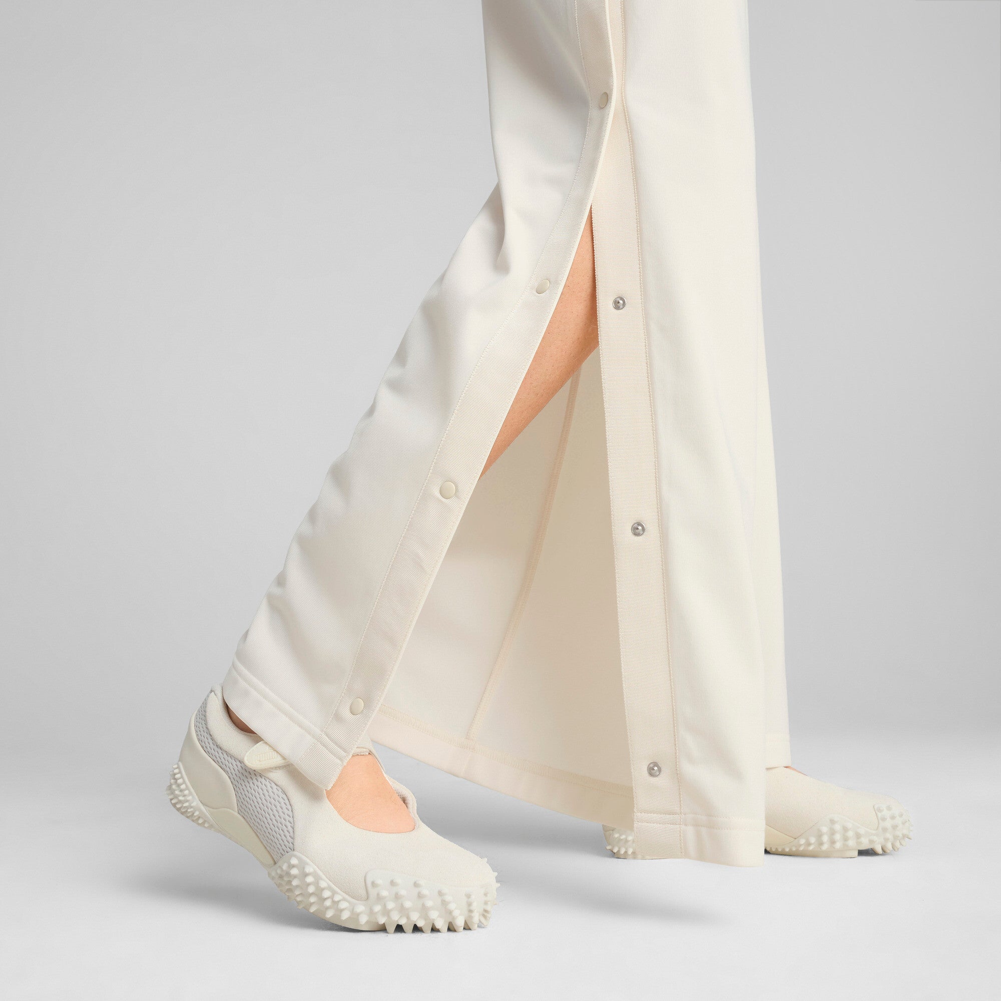 Puma wardrobe essentials low rise popper pants in white - Model Shot 02