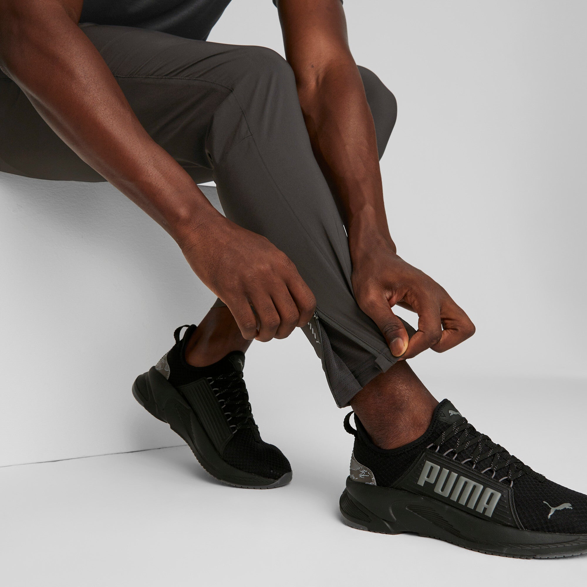 Puma running run favourite tapered pants in black - Model Shot 02