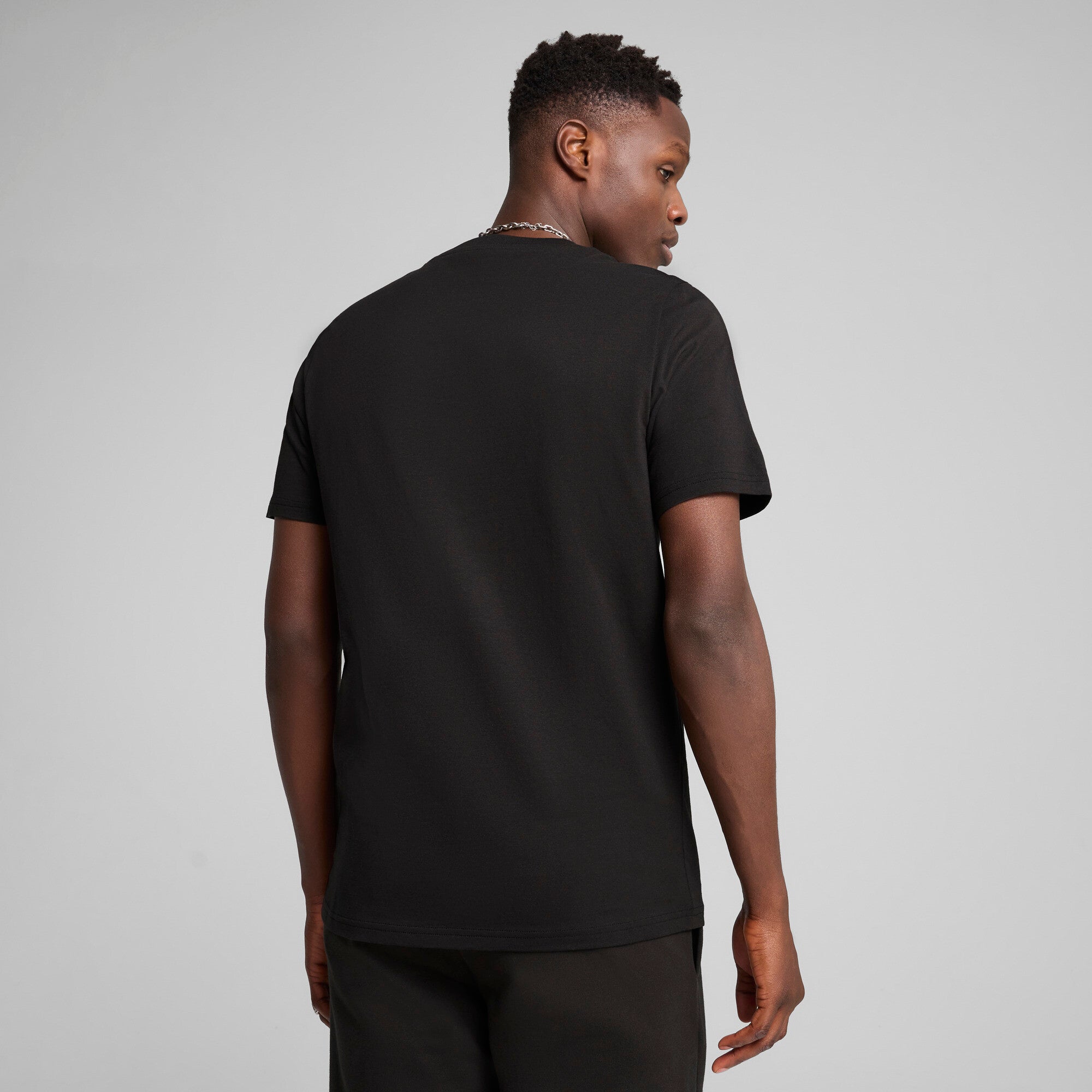 Puma sports legacy front graphic tee in black - Model Shot 02