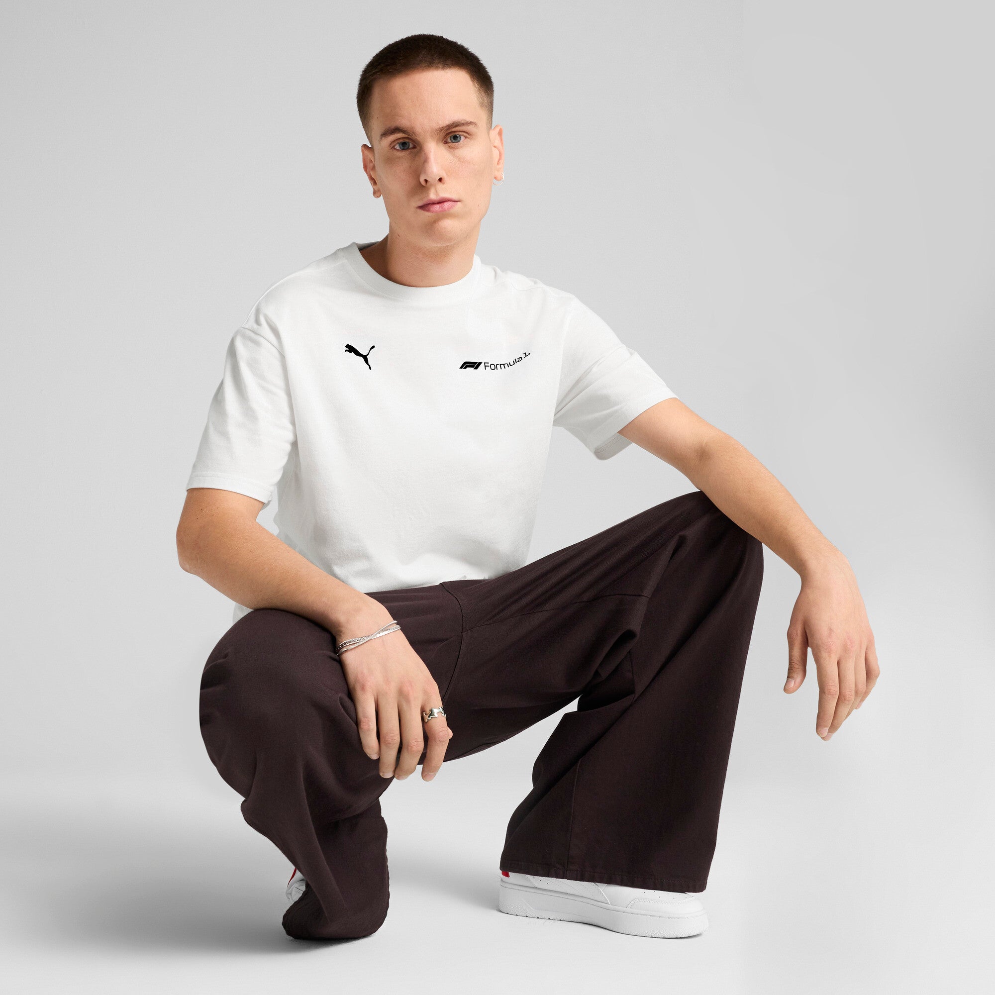 Puma F1® ESS+ relaxed graphic tee in white - Model Shot 03