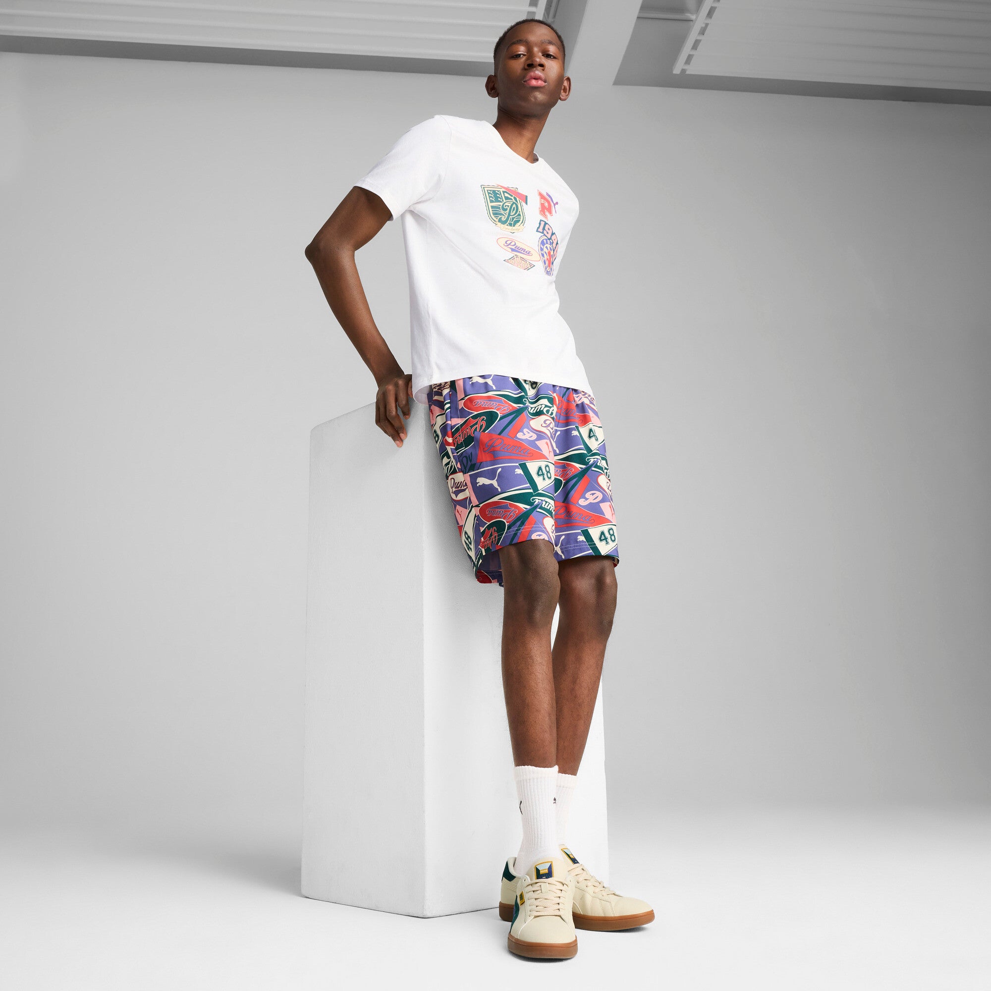 Puma sports legacy front graphic tee in white - Model Shot 03